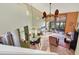 Open living room with high ceilings, tile floors, and access to patio at 4542 Park Lake N Ter # 4542, Bradenton, FL 34209