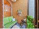 Cozy patio with green sofa and lush greenery, perfect for relaxing at 4542 Park Lake N Ter # 4542, Bradenton, FL 34209