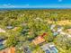 High-angle view of house nestled in a neighborhood, near water at 695 Sandy Hook Rd, Palm Harbor, FL 34683