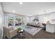 Bright and airy living room with sliding glass doors leading to a patio at 695 Sandy Hook Rd, Palm Harbor, FL 34683