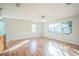 Bright and airy living room with hardwood floors and lots of natural light at 702 W Cherry St, Plant City, FL 33563