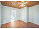 Bedroom with wood ceiling, hardwood floors, and closet at 809 W Saunders St, Plant City, FL 33563