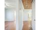 Hallway with wood floors and views into other rooms at 809 W Saunders St, Plant City, FL 33563