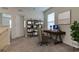 Bright home office featuring a desk, shelving, and window at 8333 Hardy Bay Loop, Wesley Chapel, FL 33545