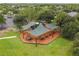 Community playground with shaded play area and swings at 8831 Garden Party Dr, Land O Lakes, FL 34637