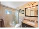 Clean bathroom with single vanity, shower, and toilet at 10546 53Rd N Ave, St Petersburg, FL 33708