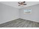 Spacious bedroom with wood-look floors and a window at 12300 Park Blvd # 103, Seminole, FL 33772