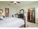 Spacious bedroom with a large bed, dresser, and TV at 13423 White Sapphire Rd, Riverview, FL 33579