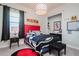 Mickey Mouse themed bedroom with a twin bed and built-in shelving at 13423 White Sapphire Rd, Riverview, FL 33579