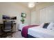 Modern bedroom with a comfortable bed and workspace at 13423 White Sapphire Rd, Riverview, FL 33579