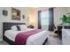 Bright bedroom with a comfortable bed and built-in workspace at 13423 White Sapphire Rd, Riverview, FL 33579