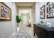 Bright and airy entryway with decorative accents and a rug at 13423 White Sapphire Rd, Riverview, FL 33579