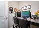 Functional home office with a granite countertop desk and two chairs at 13423 White Sapphire Rd, Riverview, FL 33579