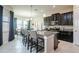 Spacious kitchen with dark cabinets, granite island and breakfast area at 13423 White Sapphire Rd, Riverview, FL 33579