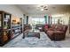 Cozy living room with sectional sofa, large TV, and wooden coffee table at 13423 White Sapphire Rd, Riverview, FL 33579