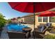 Relaxing poolside patio with fire pit and comfortable seating at 13423 White Sapphire Rd, Riverview, FL 33579