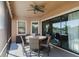 Relaxing screened patio with outdoor dining set and ceiling fan at 13423 White Sapphire Rd, Riverview, FL 33579