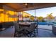 Covered patio overlooking pool area with outdoor furniture at 13423 White Sapphire Rd, Riverview, FL 33579