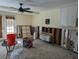 Living room under renovation, showing damaged walls and flooring at 16333 Gulf Blvd # 118, St Petersburg, FL 33708