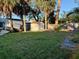 Large backyard with shed and partially damaged fence at 1711 Michigan Ne Ave, St Petersburg, FL 33703