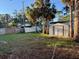 Backyard with storage shed and partially damaged fence at 1711 Michigan Ne Ave, St Petersburg, FL 33703