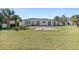 Large backyard with grassy area and spacious patio at 17163 2Nd E St, North Redington Beach, FL 33708