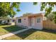 Inviting front exterior of a single-story pink house with a fenced yard at 1840 42Nd N Ave, St Petersburg, FL 33714