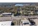 Aerial view of a property near a busy road and industrial buildings at 21434 Preservation Dr, Land O Lakes, FL 34638