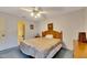 Bedroom with ensuite bathroom and ceiling fan at 2211 Whitney Pl, Valrico, FL 33594