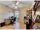 Bright home office features built-in shelving and wood flooring at 2211 Whitney Pl, Valrico, FL 33594