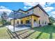 Outdoor patio area with a pergola, seating, and a built-in kitchen at 2847 Calvano Dr, Land O Lakes, FL 34639