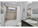 Clean bathroom with a bathtub, shower, and granite vanity at 2847 Calvano Dr, Land O Lakes, FL 34639