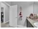 Bathroom with vanity, storage, and view of laundry room at 2847 Calvano Dr, Land O Lakes, FL 34639