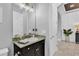 Modern bathroom with dark vanity and granite countertop at 2847 Calvano Dr, Land O Lakes, FL 34639