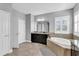 Elegant bathroom with soaking tub, double sinks, and walk-in shower at 2847 Calvano Dr, Land O Lakes, FL 34639