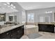Bathroom with double sinks, a bathtub and shower at 2847 Calvano Dr, Land O Lakes, FL 34639