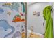 Bathroom with dinosaur-themed shower curtain and accessories at 2847 Calvano Dr, Land O Lakes, FL 34639