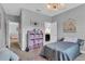 Bedroom with twin bed, pink storage, and view of hallway at 2847 Calvano Dr, Land O Lakes, FL 34639