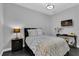 Serene bedroom with dark wood furniture and gray bedding at 2847 Calvano Dr, Land O Lakes, FL 34639