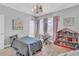 Bedroom with twin bed, bookshelf, and keyboard at 2847 Calvano Dr, Land O Lakes, FL 34639