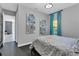 Spacious bedroom with teal curtains and a view of another room at 2847 Calvano Dr, Land O Lakes, FL 34639