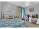Bedroom with large bed, pink chair, and fish tank at 2847 Calvano Dr, Land O Lakes, FL 34639