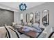 Formal dining room featuring statement lighting and mirrors at 2847 Calvano Dr, Land O Lakes, FL 34639