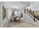 Elegant dining room with a large table and statement lighting at 2847 Calvano Dr, Land O Lakes, FL 34639