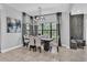 Elegant dining room with modern chandelier and seating for six at 2847 Calvano Dr, Land O Lakes, FL 34639