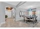 Bright dining room with view into entryway and staircase at 2847 Calvano Dr, Land O Lakes, FL 34639