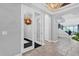Bright entryway with tile floors, double doors, and a chandelier at 2847 Calvano Dr, Land O Lakes, FL 34639