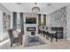 Elegant home bar with seating, stone feature wall, and TV at 2847 Calvano Dr, Land O Lakes, FL 34639
