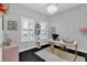 Home office with a desk, shelving, and a large window at 2847 Calvano Dr, Land O Lakes, FL 34639