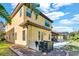 Two-story house with a yellow exterior and a large backyard at 2847 Calvano Dr, Land O Lakes, FL 34639